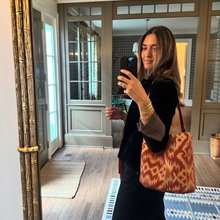 Load image into Gallery viewer, Woman taking a mirror selfie in a home setting with a patterned bag.
