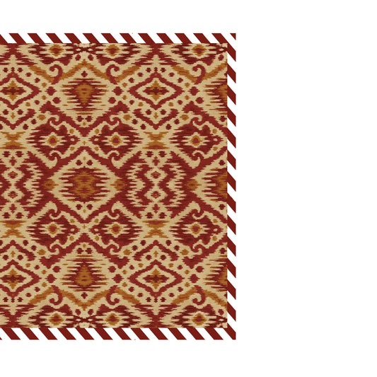 Patterned cloth napkin with red and beige ikat design on a white background