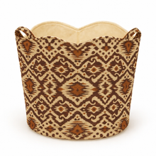 Load image into Gallery viewer, Ikat brown and beige patterned basket tote bag with handles on the side a white background

